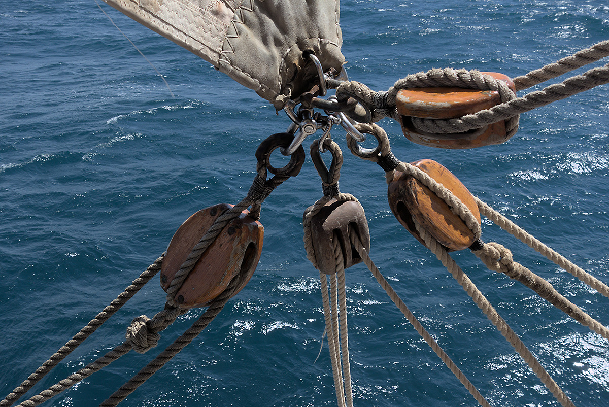 sailing - four ropes connected at a single corner of a sail